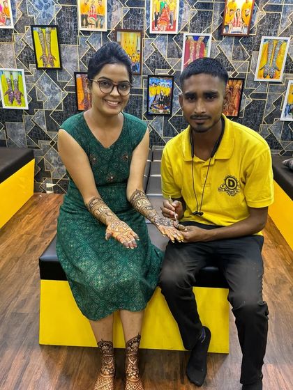 A client with one of our artists in the studio. We provide a one-on-one comfortable experience.