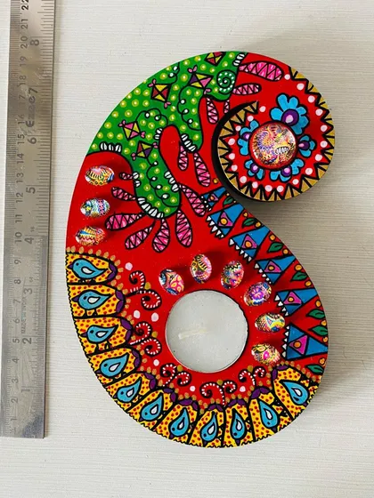 Another one of my paisley candle holders, this one in a fiery red with intricate blue and yellow details. Each one is painted differently, so you get a truly unique piece.