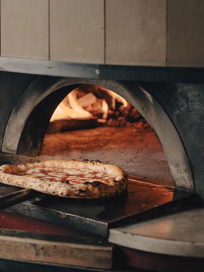 This pizza is not just ready, it's begging to be devoured. One bite, and there's no going back.