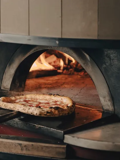 This pizza is not just ready, it's begging to be devoured. One bite, and there's no going back.
