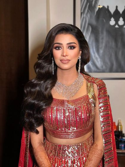 A beautiful portrait of Sakshi. The soft glam makeup with a bold eye is perfect for a sangeet or reception.