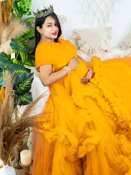 A burst of sunshine in our studio. This bright yellow tulle gown brings so much joy and energy to the portrait, perfectly complementing the lush green and pampas grass decor.