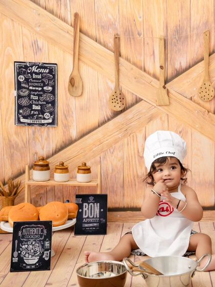 A sweet moment captured as this little chef tastes his ingredients. These sessions are full of adorable, unscripted moments.
