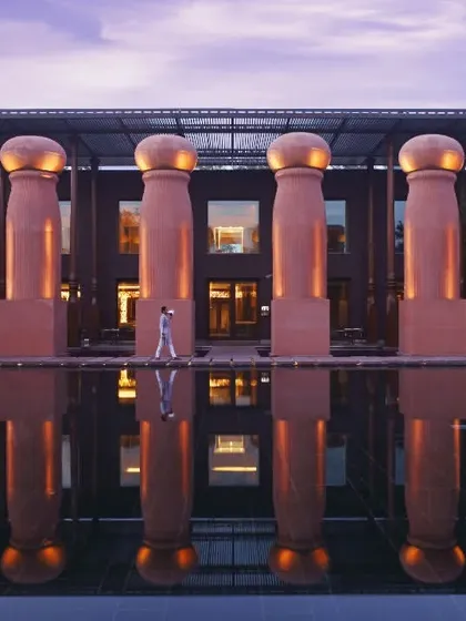 The view of our restaurant, Kiyan, at dusk. The lit pillars reflecting in the water create a truly special ambiance for an evening meal.