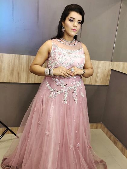 A closer look at this pretty pink rental gown. The illusion neckline and scattered silver work add a touch of sparkle without being overwhelming.