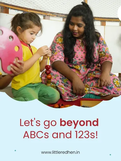 We go beyond just ABCs and 123s. Our curriculum is crafted with diversity, creativity, and a lot of heart, ensuring we nurture the whole child. Here, a teacher guides a child in a hands-on sensory activity.