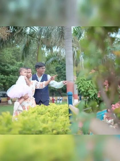 A candid family moment during an outdoor shoot in a local park. Natural, unposed interactions like this create authentic and heartwarming family portraits.