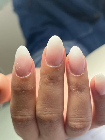 The classic baby boomer nail set. This timeless look features a seamless ombré blend from a soft pink base to a clean white tip, perfect for any occasion.