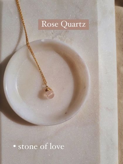 A closer look at my bī́ja Rose Quartz round pendant. This stone of love carries gentle, loving vibrations. I craft these simple pendants to be worn daily, helping you fix relationship issues and attract connection.