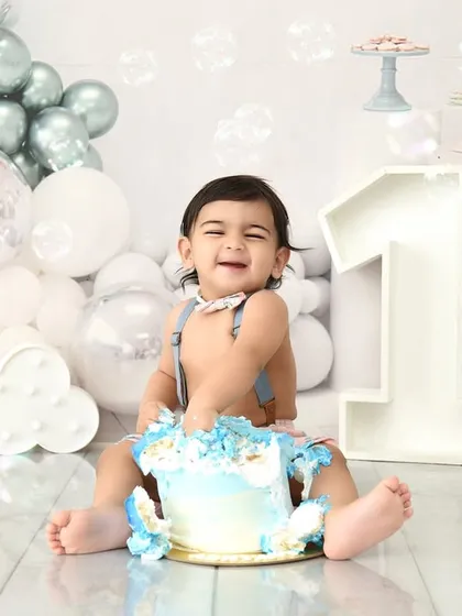 Let's make a mess! A cake smash session is the perfect way to celebrate a first birthday. This little one is having the time of his life, and these are the fun, chaotic, and happy memories you'll cherish.