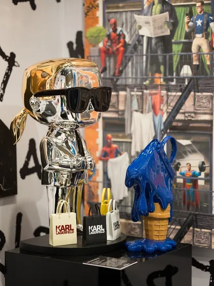 A corner of our booth at The Wedding Collective, featuring 'The Karl Persona' and 'I Scream Kelly' sculptures. Each piece has its own voice, creating a symphony of pop.