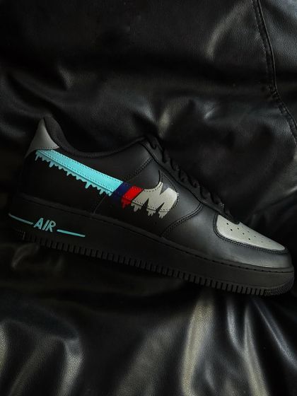 A side profile of the BMW drip custom sneaker on a black background.