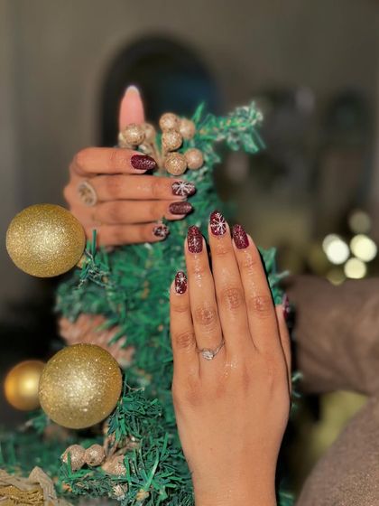 Another angle of our popular snowflake nail art, perfect for the winter season.