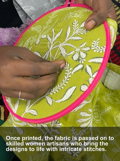 Once printed, the fabric is passed to our skilled women artisans who bring the designs to life with intricate stitches. This image captures the moment a floral Chikankari pattern begins to take shape.
