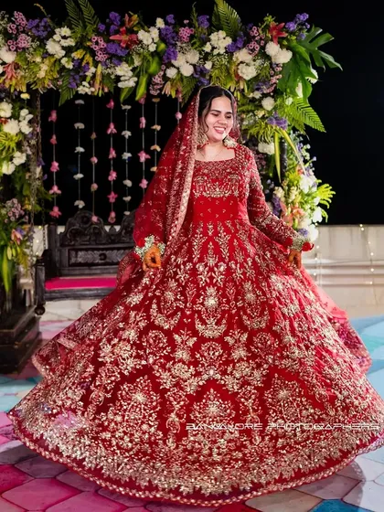 The bride, in all her splendor. I focus on capturing the grandeur of the moment as she twirls, her magnificent lehenga telling a story of tradition, joy, and the beginning of a beautiful forever.