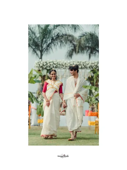 The couple taking their first walk together as husband and wife, framed by the beautiful outdoor wedding setting.