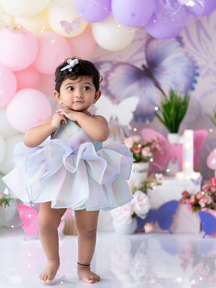 The cutest ballerina in her pastel tutu. A beautiful portrait from a first birthday session.
