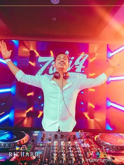 Arms wide open, embracing the energy of the massive crowd at the NYE party. An unforgettable moment.