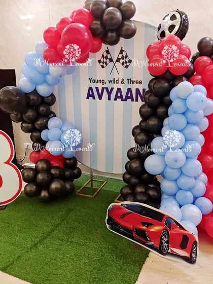 A closer look at the car-themed photo corner, showing the checkered flag details and the bold red, black, and blue color scheme.