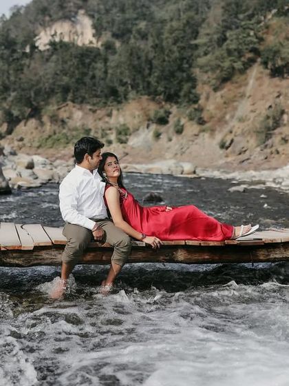 A serene moment on a rustic wooden bridge over a rushing stream. This location is one of the hidden gems I love to take my couples to for unique shots.