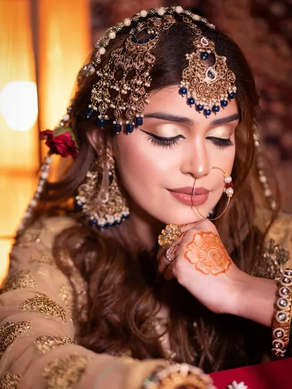 Eyes closed, this shot allows a full appreciation of the detailed eyeshadow work and blending in this Heeramandi-inspired look.