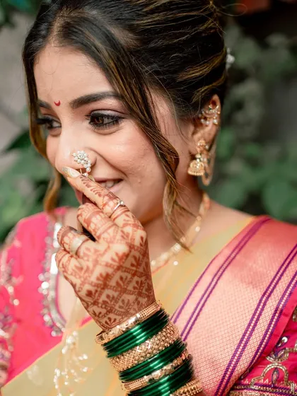 A playful and happy moment with my bride Shreya during her vidhi ceremony, highlighting her intricate nath and mehndi.