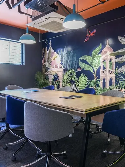 Meetings don't have to be in a sterile white box. This conference room features a lush, tropical-themed wallpaper, bringing an element of nature and surprise indoors to create an inspiring oasis for brainstorming and collaboration.
