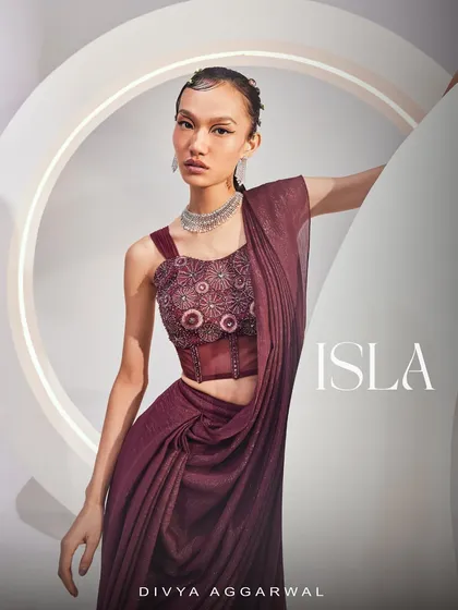 A portrait in the ISLA Saree Set, highlighting the unique silhouette and rich color, perfect for a modern festive look.