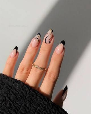An edgy and modern design with black tips and abstract black swirls on a sheer base.