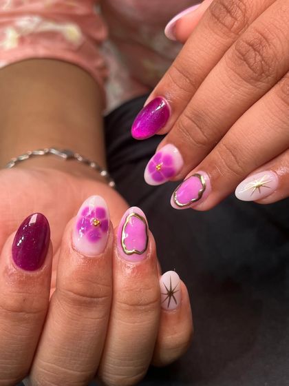Another angle of the purple floral festive nails, showing the beautiful watercolor effect on the petals.