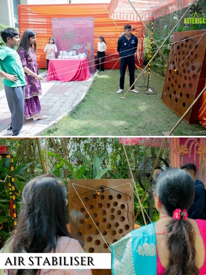 Guests participating in an "Air Stabilizer" game, a fun and challenging activity for all ages.