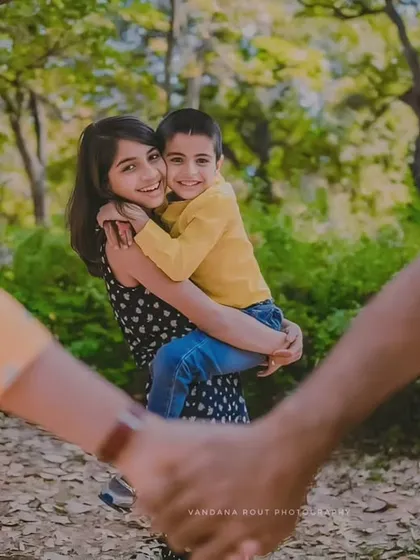 A creative family portrait where the children are framed by their parents' hands. This shot from a Cubbon Park family session shows my love for finding unique perspectives that tell a story of connection and protection.