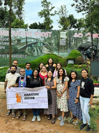 A group photo at Siri Cafe in Chikmagalur, a popular stop with its unique Adiyogi statue and beautiful garden.