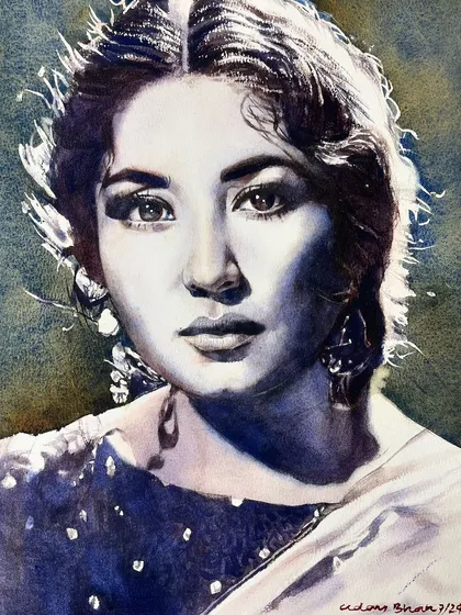 A powerful monochrome portrait of actress Meena Kumari, capturing her intense and soulful gaze.