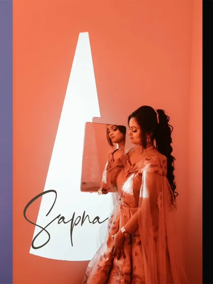 A bridal portrait using a projector to cast a sharp, graphic shape of light, creating a modern and artistic composition.