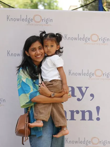 We are a community of families. This photo from one of our events captures the warm, supportive atmosphere we cultivate, where parents are an integral part of their child's learning journey.