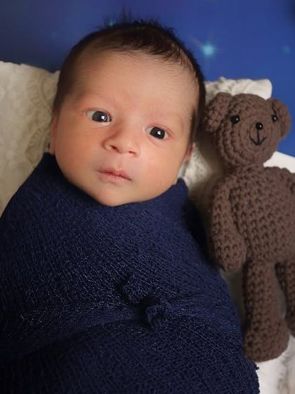 An awake baby in our starry night setup. Their direct gaze makes it feel like they are the star of the show.
