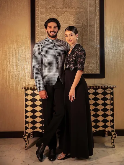 A sophisticated couple's look. The houndstooth bandhgala jacket by Shahab Durazi is a classic yet modern choice for any formal Indian event.