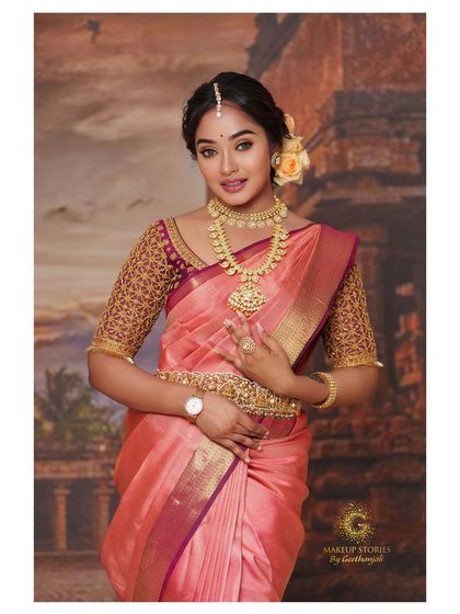 A full-length shot of the actress in the peach and maroon ensemble, showcasing a complete look for a bridal photoshoot or event.