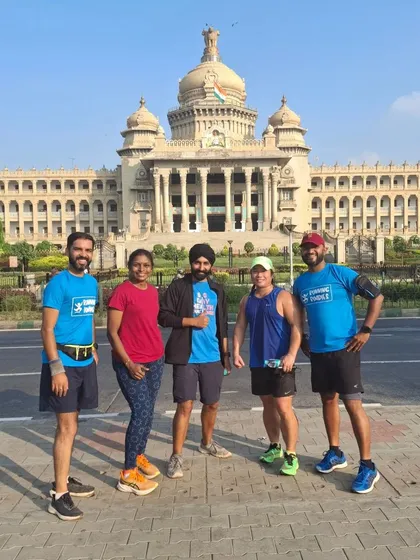 A classic post-run group photo in front of the magnificent Vidhana Soudha. Our runs often take us past Bengaluru's most famous landmarks, making for a great scenic workout.