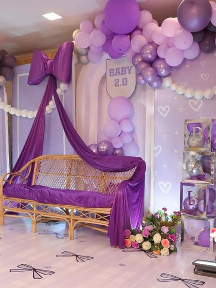 The right side of the bow-themed stage, featuring a cute teddy bear in a pink dress and custom 'BABY' blocks, adding a touch of sweetness to the chic decor.