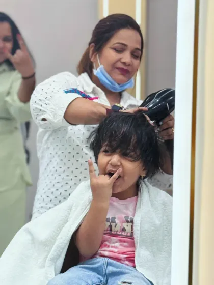 This little rockstar is having a blast during her haircut. We love the energy and joy our youngest clients bring to the salon.