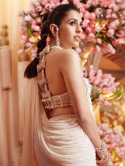 A close-up of the stunning back of the custom Tamara Ralph saree. The bow details and intricate beading are what make this piece so special and couture.