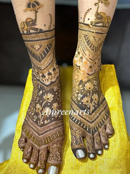 A close-up of the floral and elephant-themed foot design, showing the beautiful symmetry and detail.