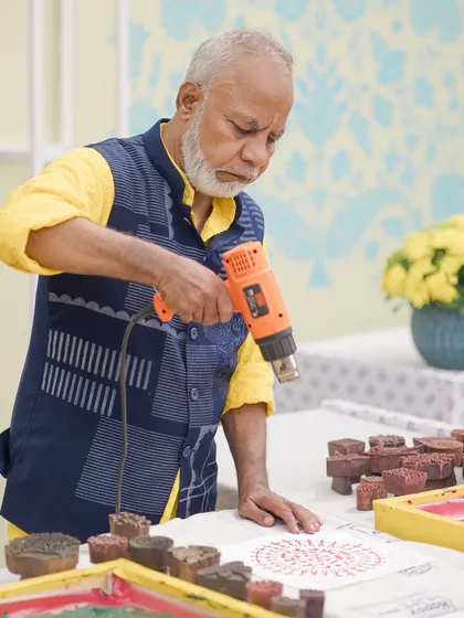 We arranged for a live block-printing artist to be at the Haldi, allowing guests to engage with the traditional craft that inspired the decor.