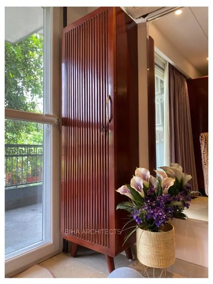 The final result of meticulous craftsmanship: a bespoke wooden wardrobe with vertical fluting detail. This piece, seen in a recently completed Gurgaon home, demonstrates how our attention to detail during the design and construction phases translates into beautiful, high-quality finished furniture.