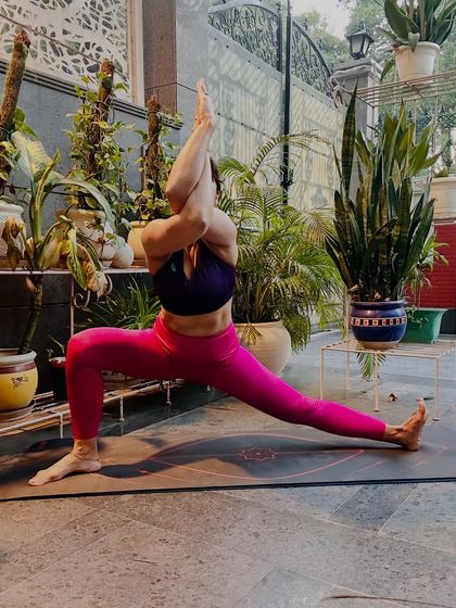 A side lunge, Skandasana, with Garudasana (Eagle) arms. This pose opens the hips and shoulders simultaneously, teaching us to find stillness and focus when the breath wanders.