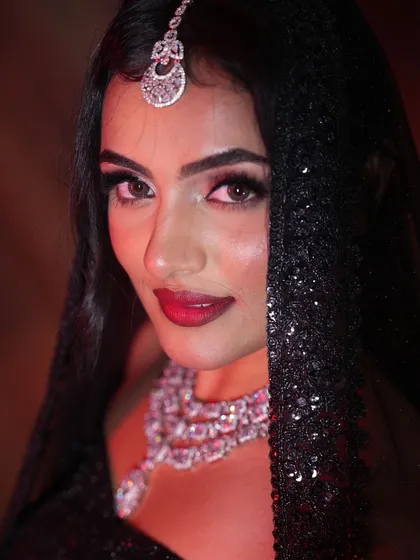 For a glamorous reception or cocktail party, nothing beats the sparkle of a diamond and CZ set. This close-up shows the intricate details and brilliant shine of a multi-layered necklace and matching maang tikka.