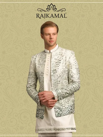 This striking Indo-Western jacket, worn by a model, perfectly captures my vision of blending modern style with traditional elegance. The intricate sequin work on the grey and white fabric makes it a standout piece for any wedding or sangeet.