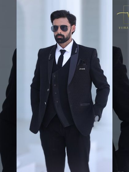 Another angle of the black suit, showing its versatility and sharp tailoring.